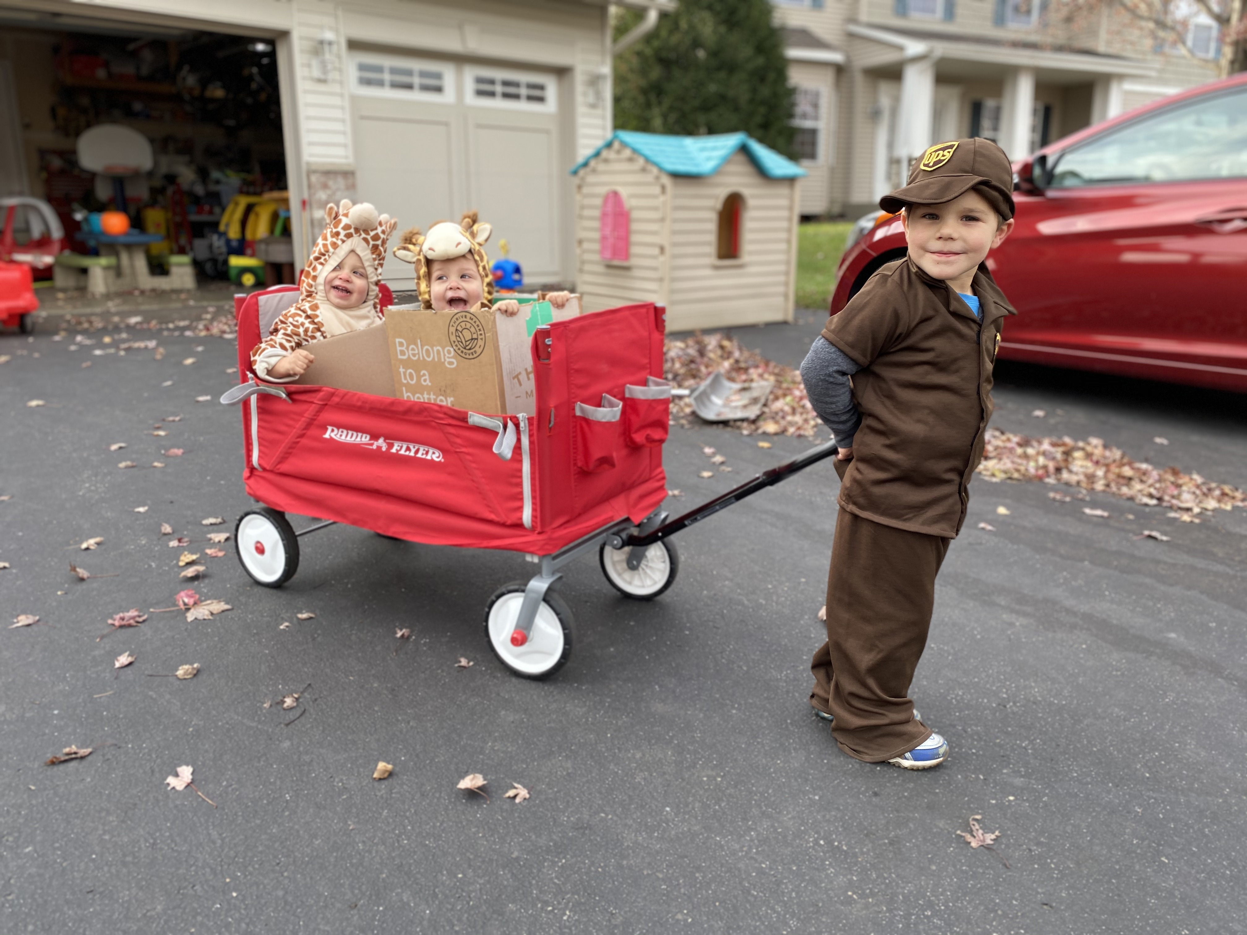 UPS Man delivering twin giraffes in boxes (my sons)