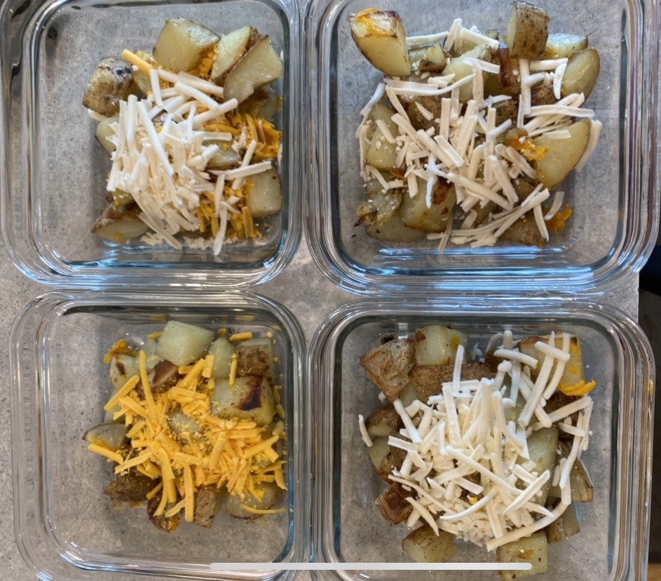 Potato containers with shredded cheese on top