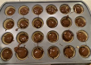 chocolate covered peanut butter cups prep with chocolate poured over